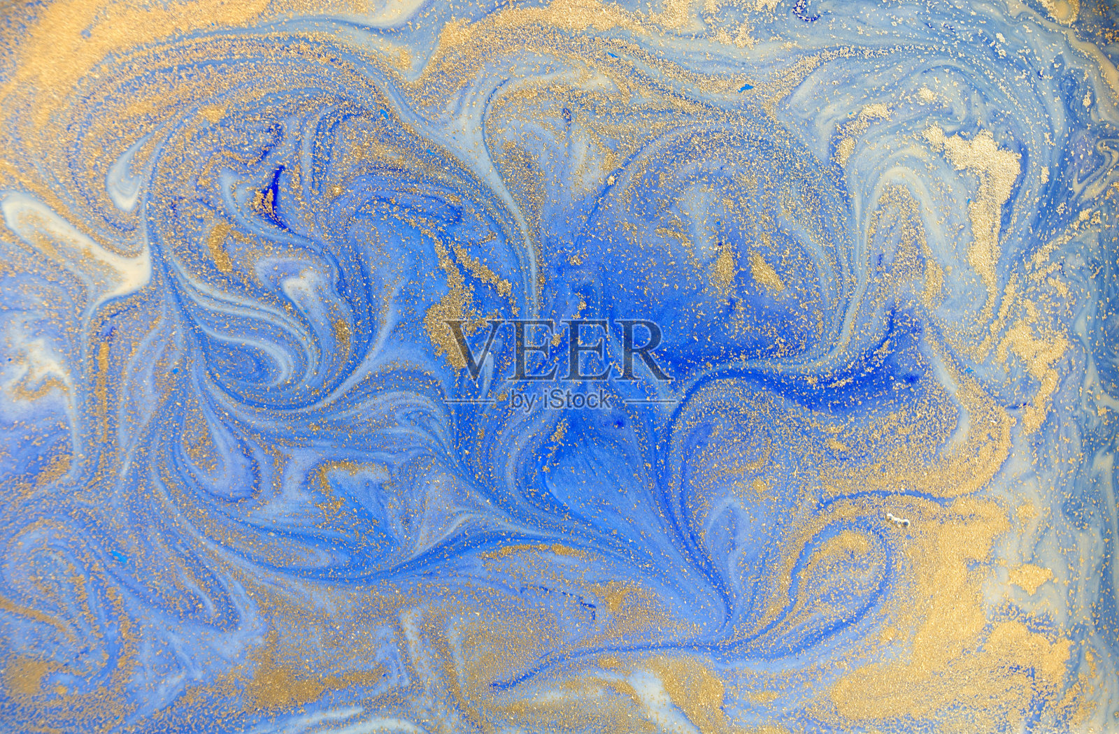 蓝色和金色的液体质地。水彩手绘大理石花纹插图。墨水大理石背景。照片摄影图片