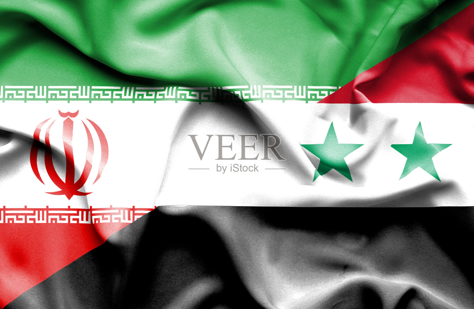 挥舞着叙利亚和伊朗的旗帜照片摄影图片