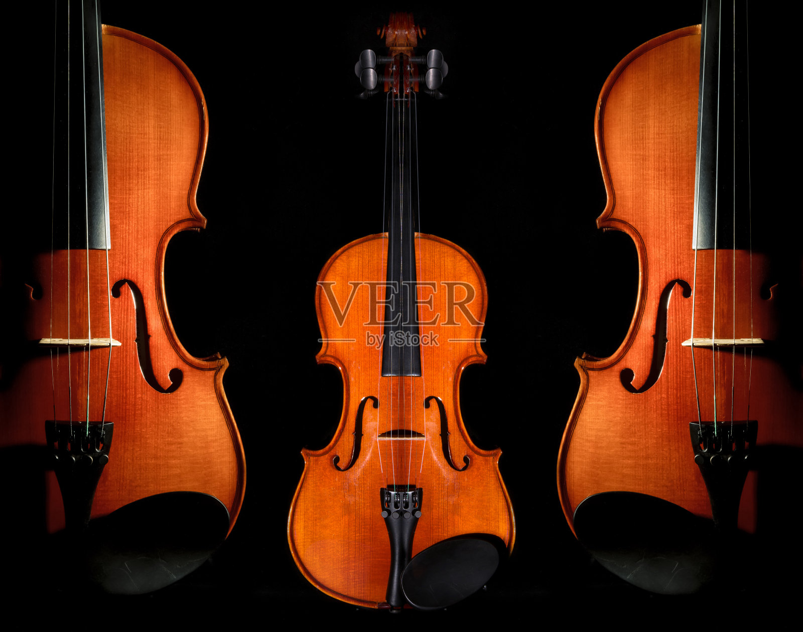 黑色背景上的小提琴管弦乐器特写照片摄影图片
