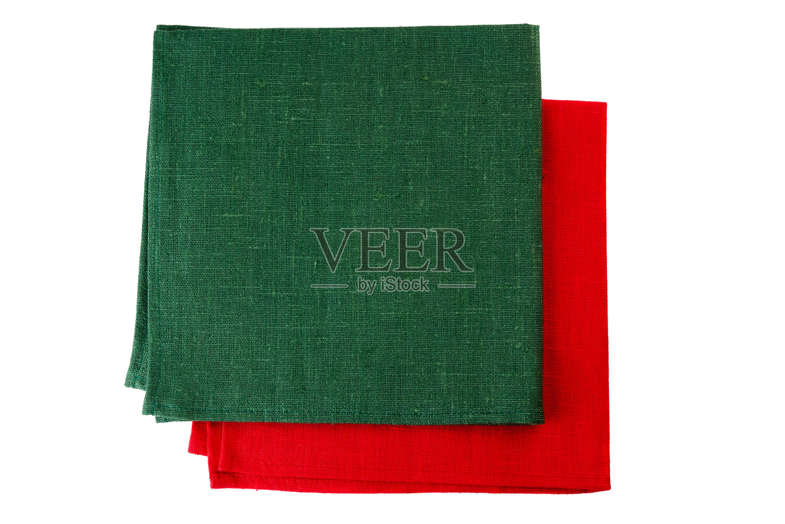 两张绿色和红色的纺织餐巾，放在白色的上面照片摄影图片