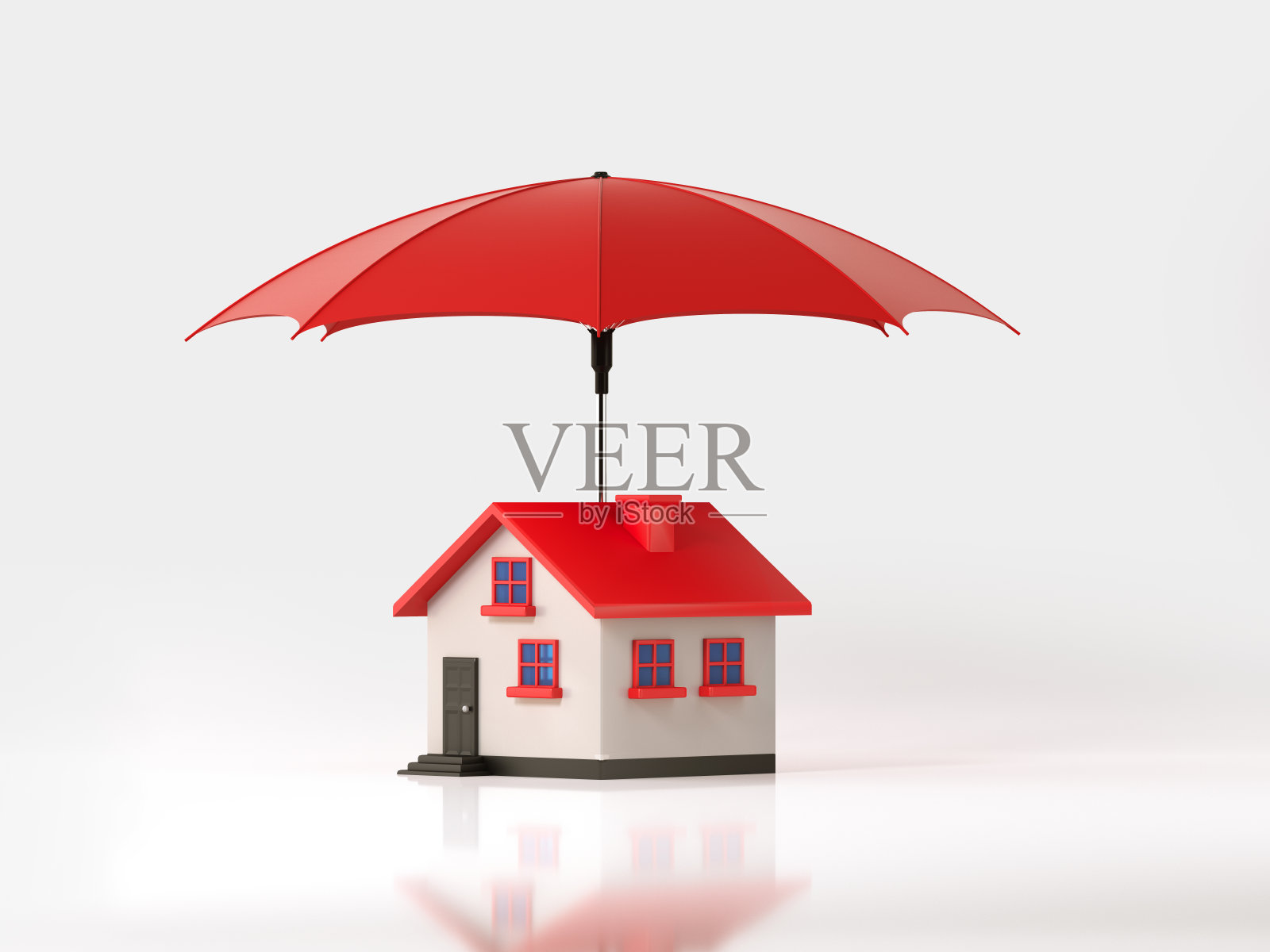 红色伞保护一个玩具房子在白色的背景:保险和房地产概念照片摄影图片