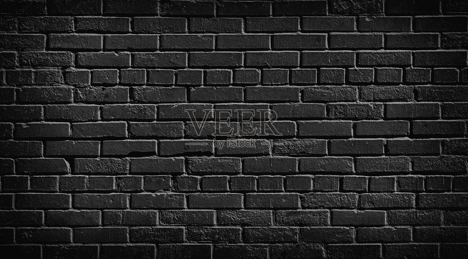 旧的黑色砖墙背景。照片摄影图片