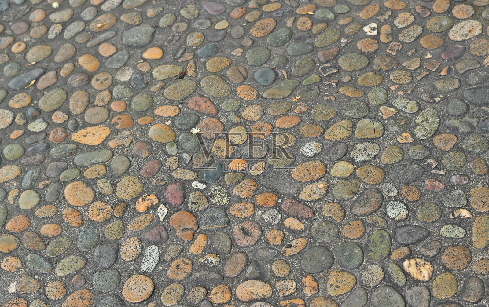 装饰地面花纹的砾石石头照片摄影图片