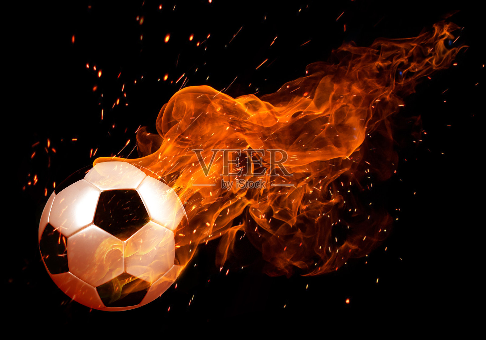 足球的形象在火焰的黑色背景照片摄影图片
