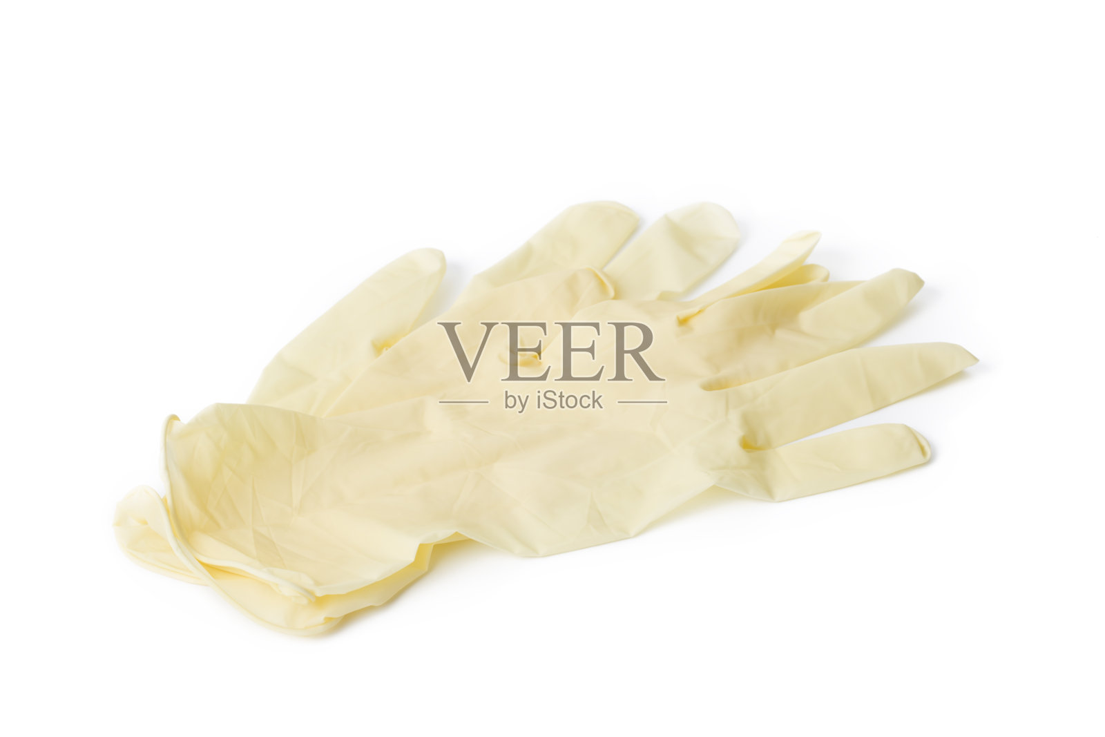 白色背景上的黄色防护医用或清洁手套。照片摄影图片