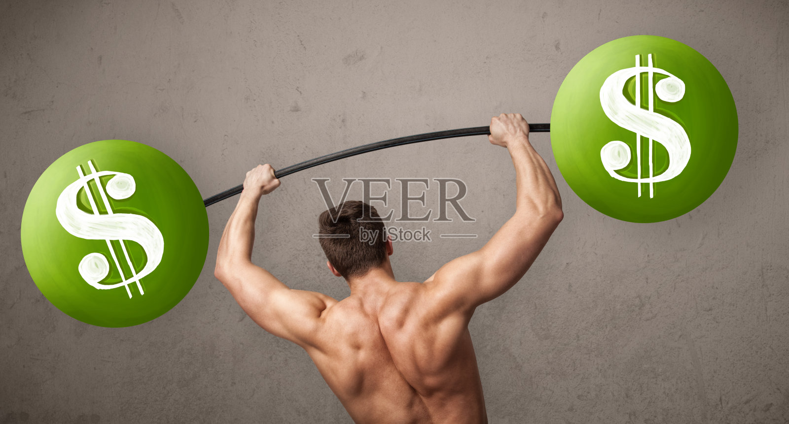 肌肉发达的男子举起绿色美元符号的重量照片摄影图片