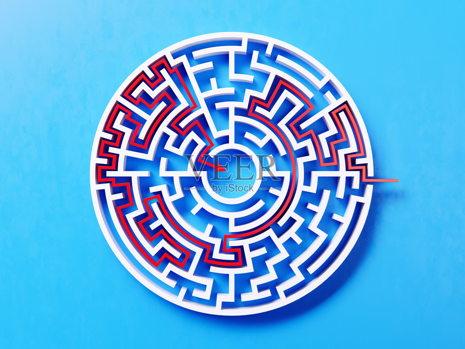 红色路径穿过一个圆形的白色迷宫在蓝色背景照片摄影图片