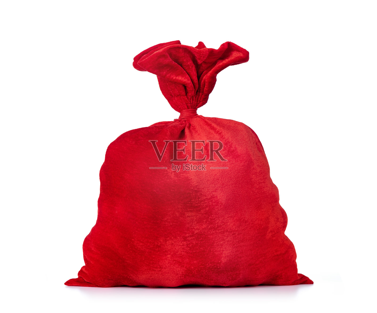 圣诞老人的红色袋子，饱满，孤立在白色的背景上。文件包含到隔离的路径。照片摄影图片