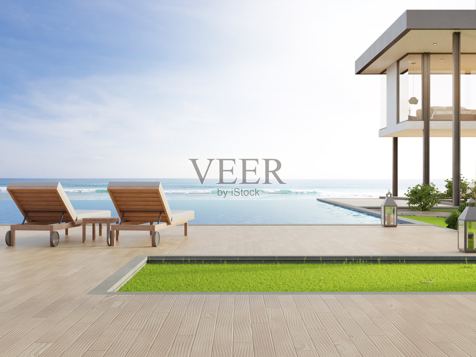 现代设计的豪华海滨别墅，海景游泳池和露台。在度假屋或酒店的木地板甲板上的躺椅。照片摄影图片