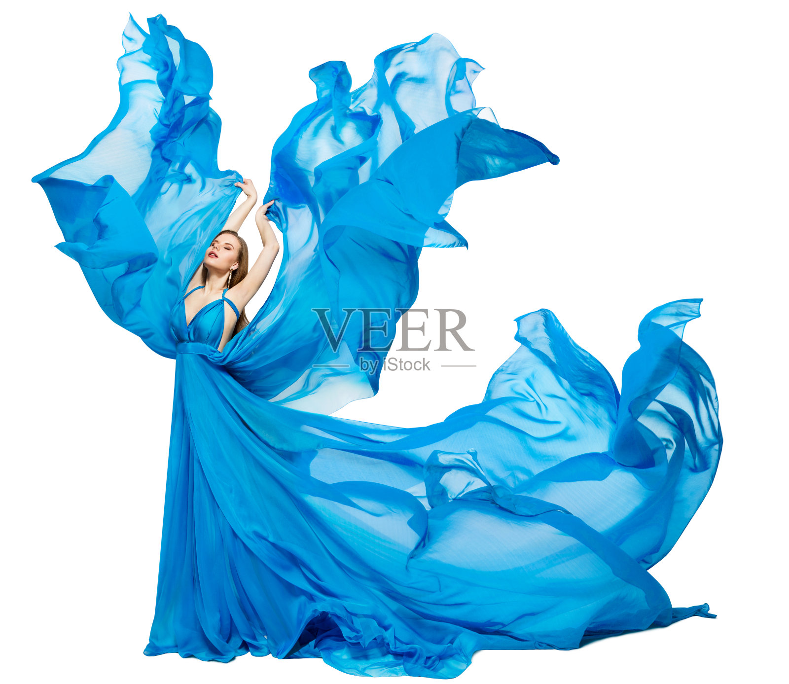 飘动如波的女子蓝裙，飘动的丝绸，在彩色织物上的白色艺术时装模特照片摄影图片