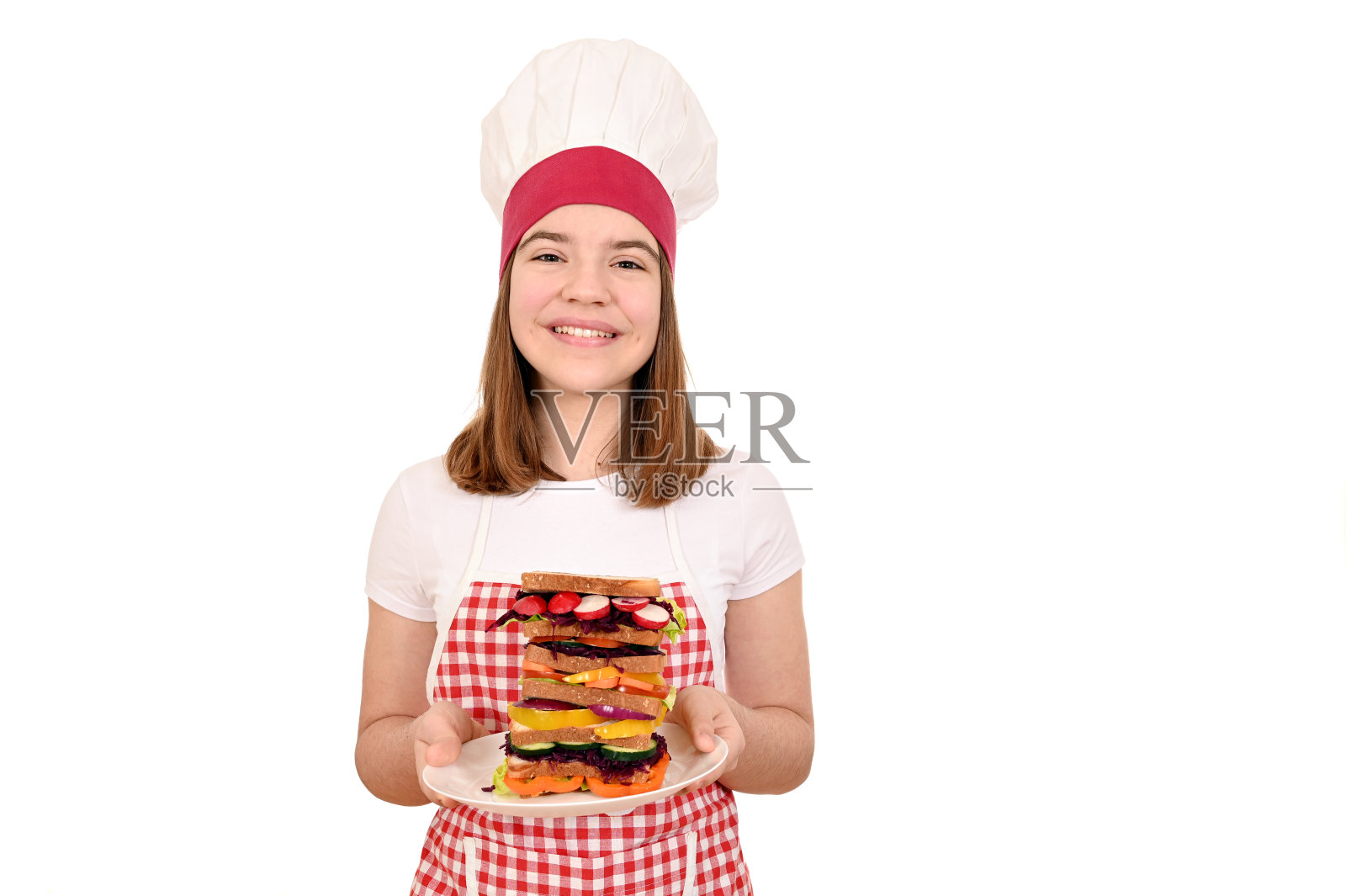 快乐的女厨师用蔬菜三明治照片摄影图片