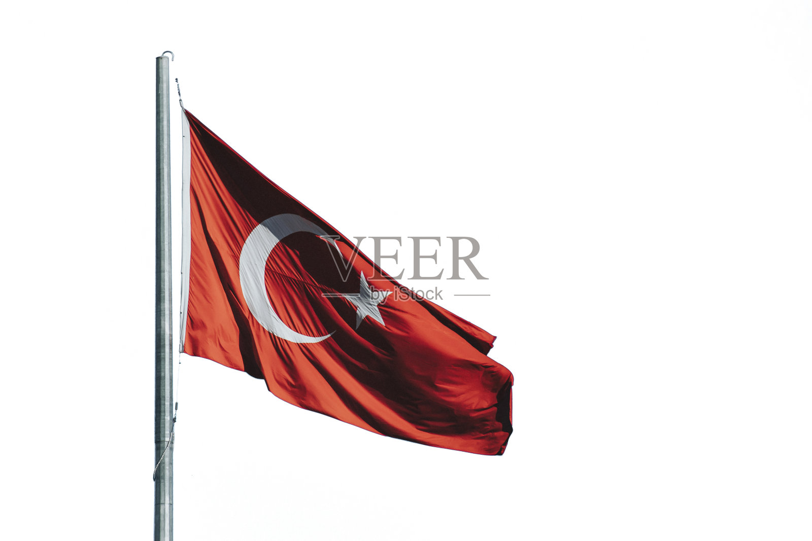 挥舞着白色背景的土耳其国旗照片摄影图片