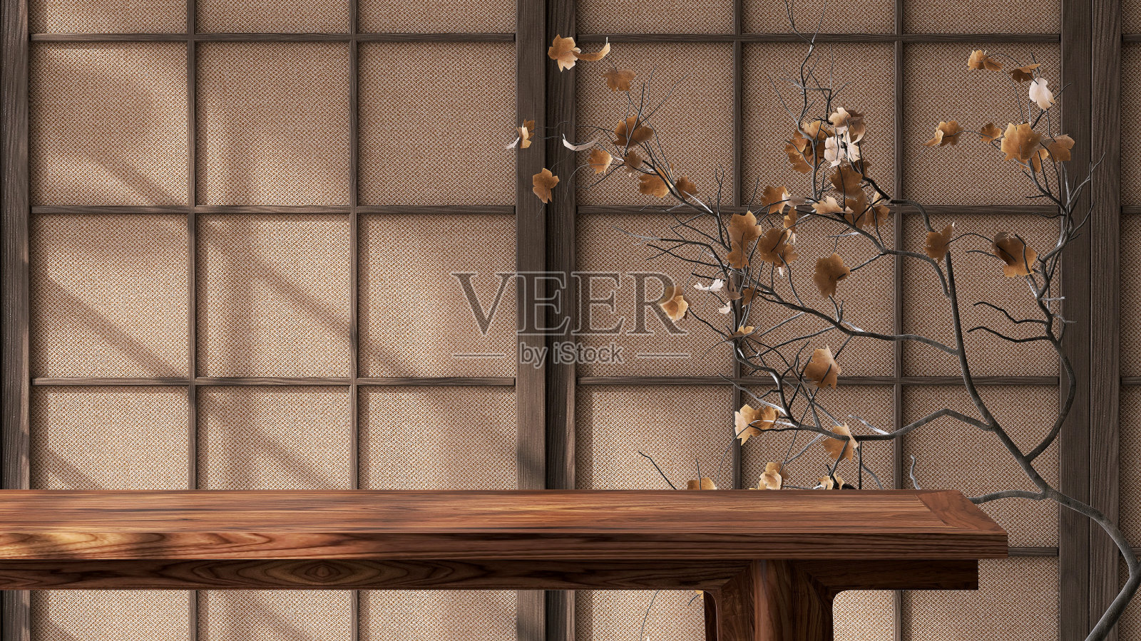 木制桌面与干燥的树枝和树叶在阳光下从窗户上传统的日本格子框架墙与棕色织物床单照片摄影图片