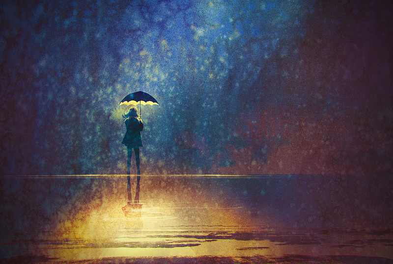 孤独的女人在伞下在黑暗中发光图片下载